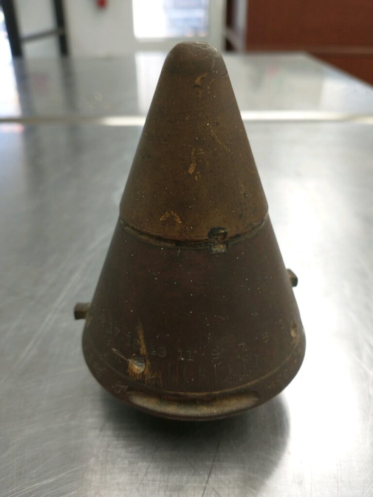 Decorative brass proximity fuse, before vapor honing